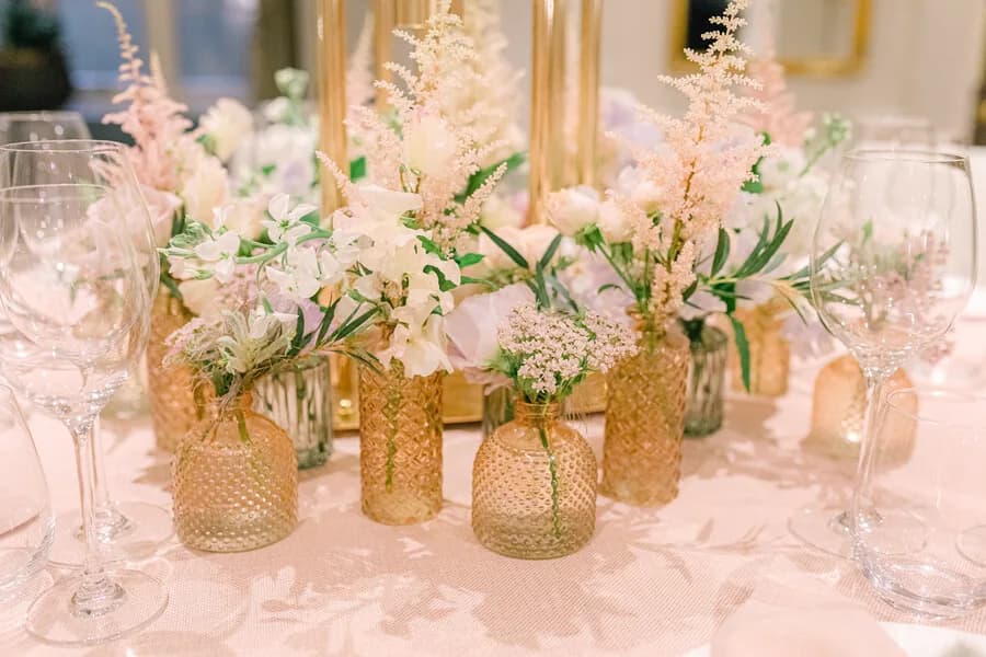 Buttonholes and bud-vase details on a place setting