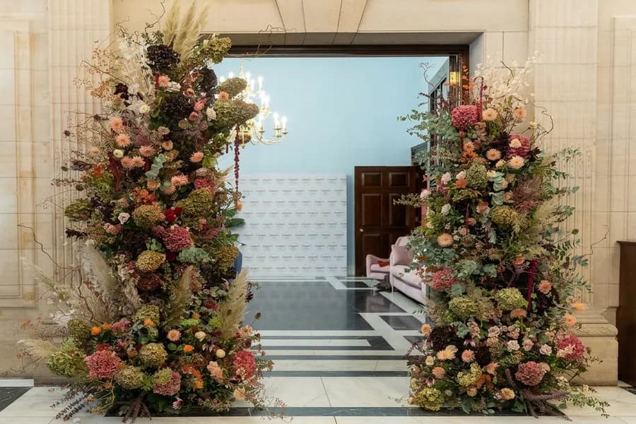 A floral column at a reception entrance