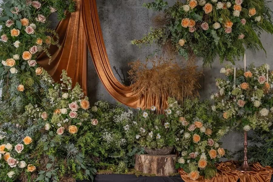 A hanging floral suspension above a dining space