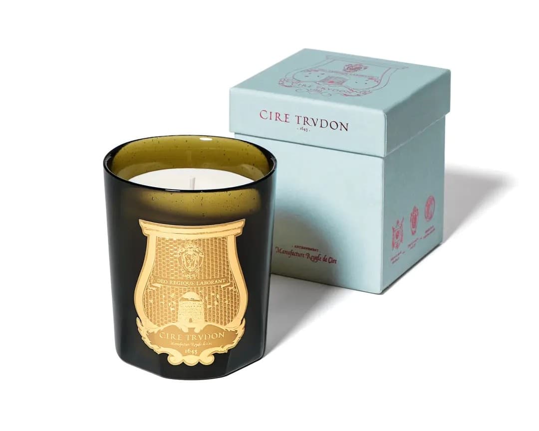 Cire Trudon Spiritus Sancti candle in its signature green glass with gold emblem