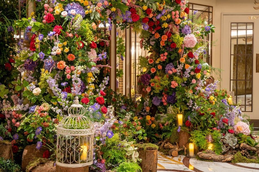 Colourful flower arch for weddings by Moyses Stevens Flowers