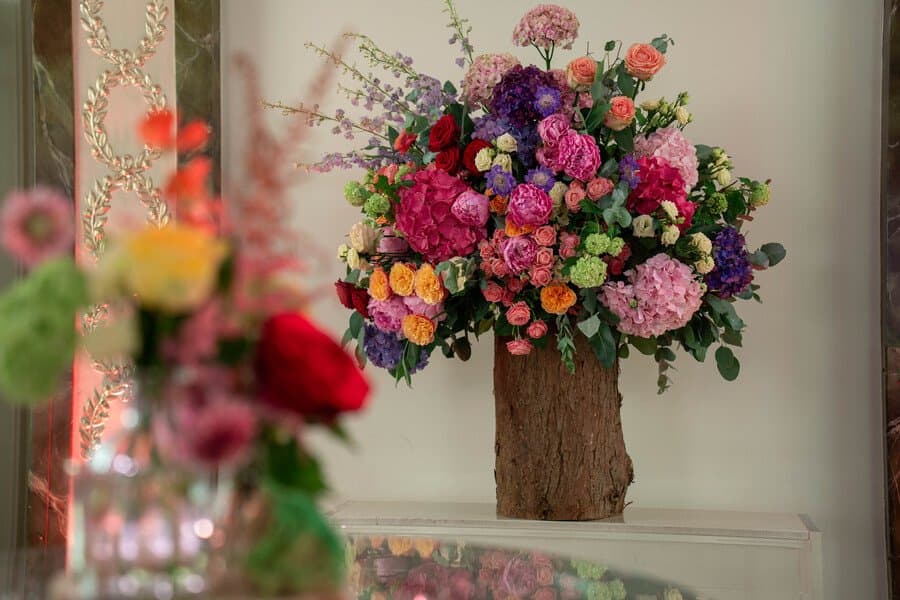Hanging floral installation over wedding reception by Moyses Stevens