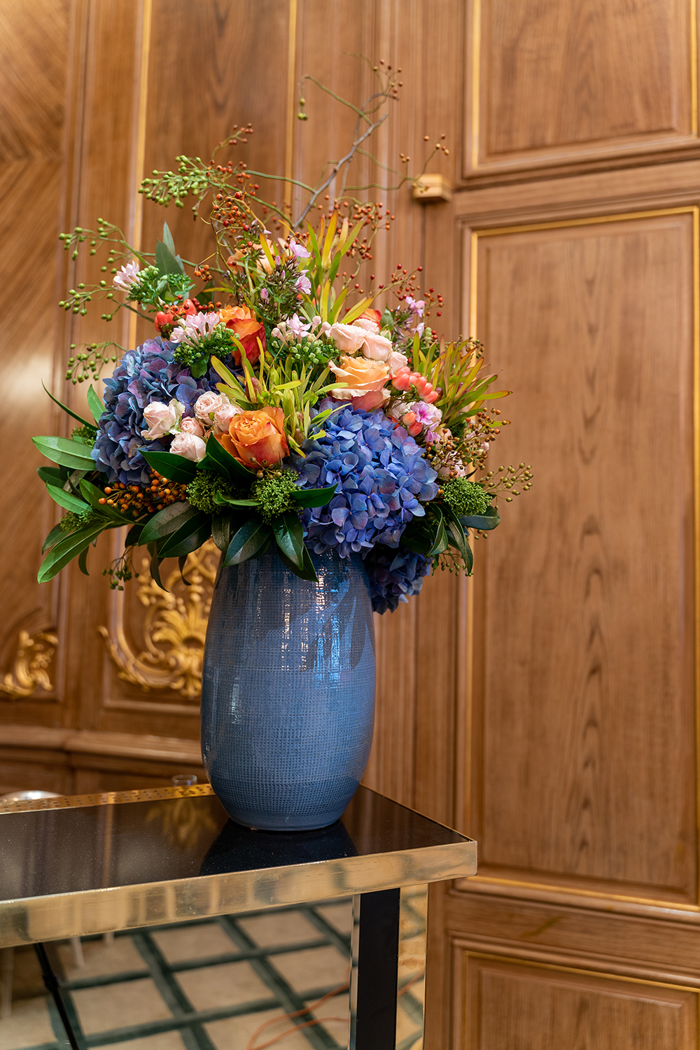 A large focal vase of flowers created by Moyses Stevens Contracts team